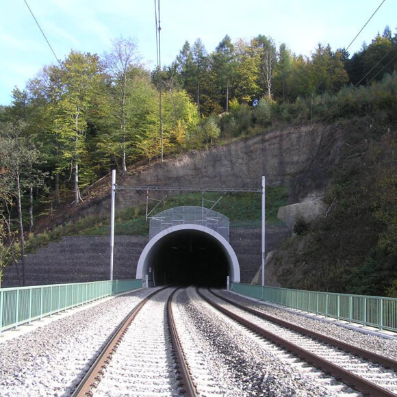 A railway track going into a railway tunnel